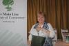 Barbara Bolton from Pegasus Technologies LLC  wins wine bottle from the Main Line Chamber of Commerce in business card raffle 