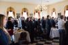 Guest of the Inspirational Breakfast standing in reverence for the National Anthem 