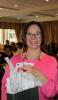 MLCC board member Joan Chrestay from Community College of Philadelphia wins wine bottle from the chamber in business card raffle